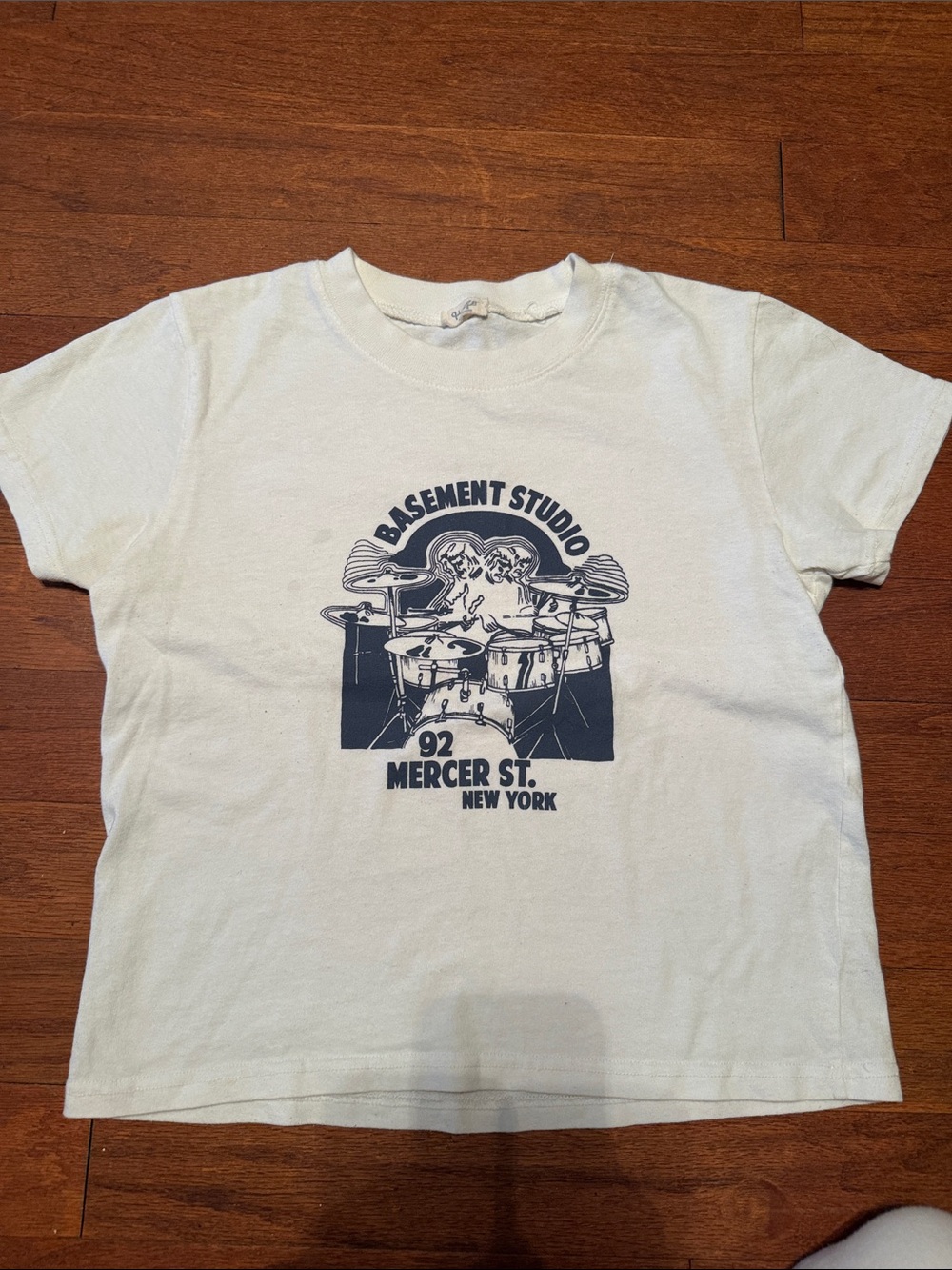 Brandy Melville Off-White Kids Graphic Tee with Navy Drum Print